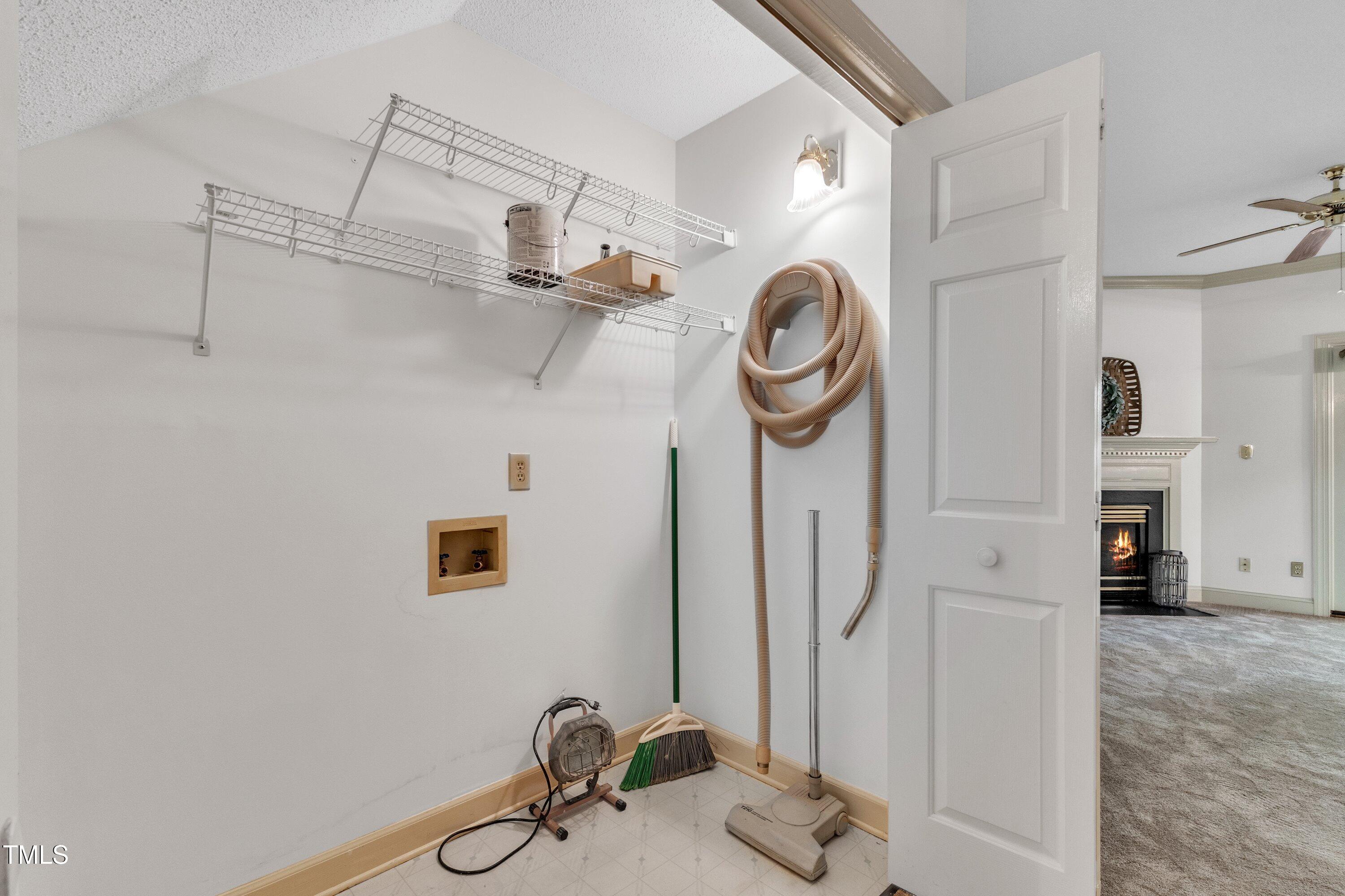 1210 Shadow Bark Court Raleigh, NC 27603 - Photo 13 of 32 a bathroom with a mirror and a shower