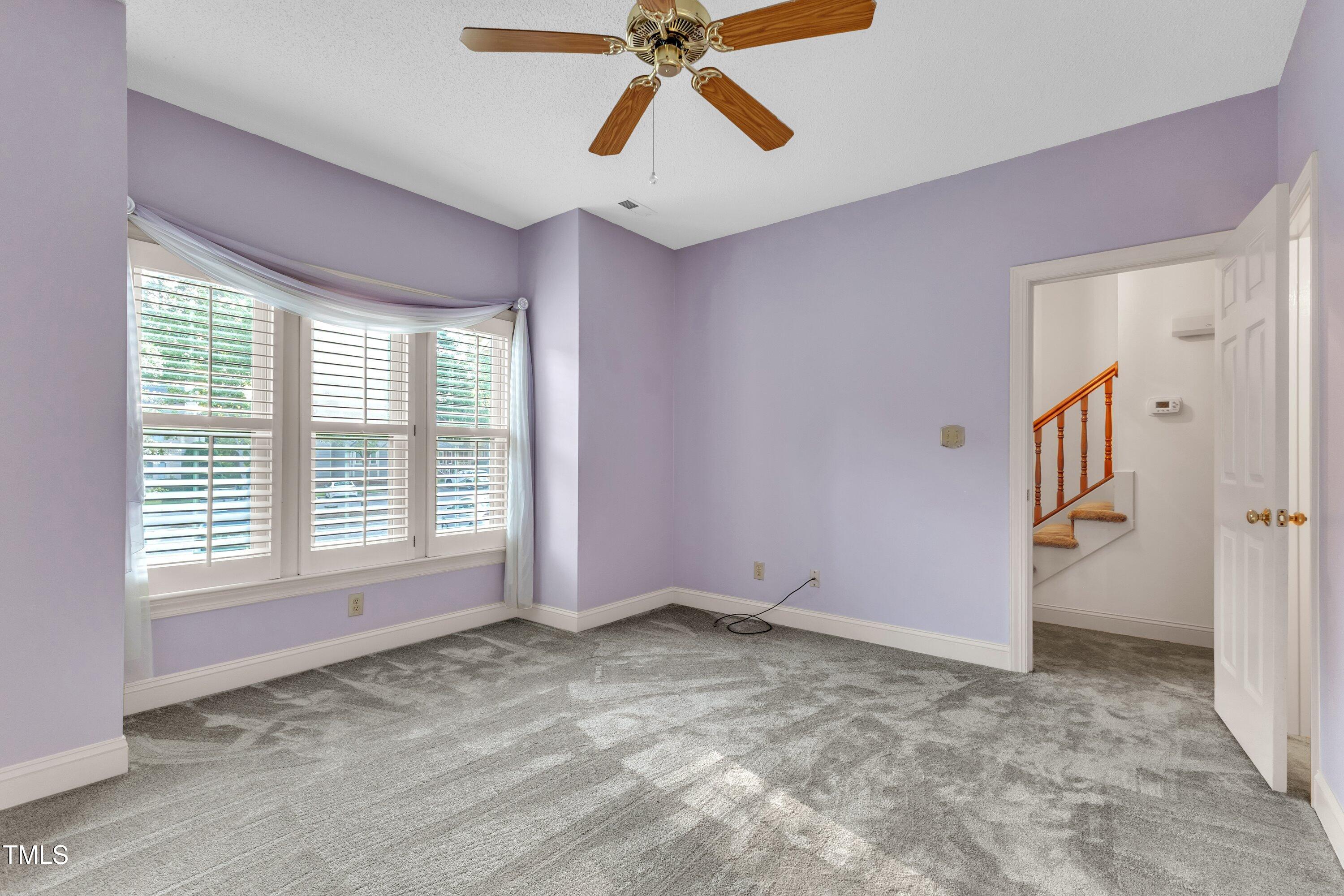 1210 Shadow Bark Court Raleigh, NC 27603 - Photo 14 of 32 a view of entryway and hall with a chandelier fan