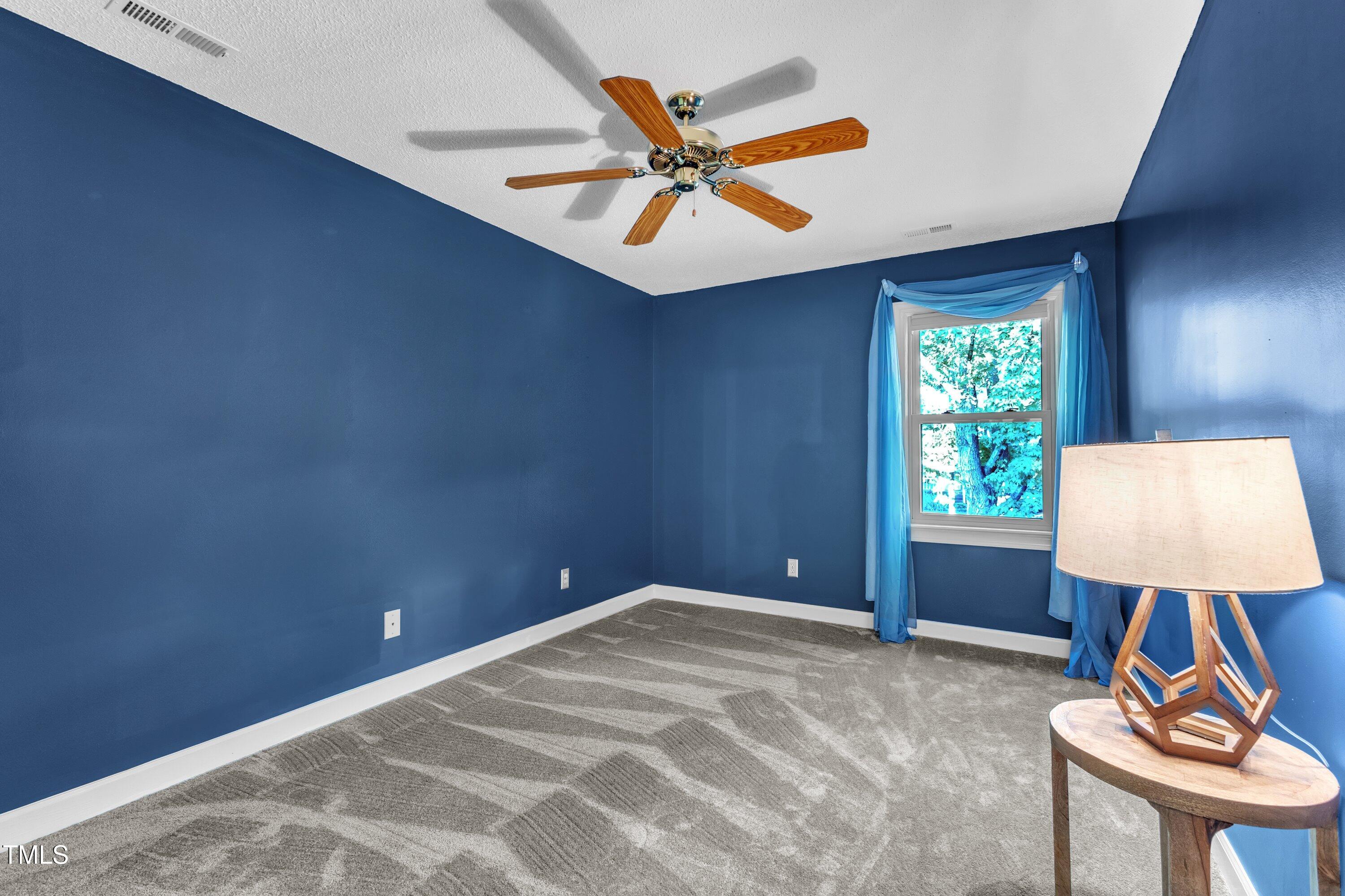 1210 Shadow Bark Court Raleigh, NC 27603 - Photo 20 of 32 a view of room with window and ceiling fan