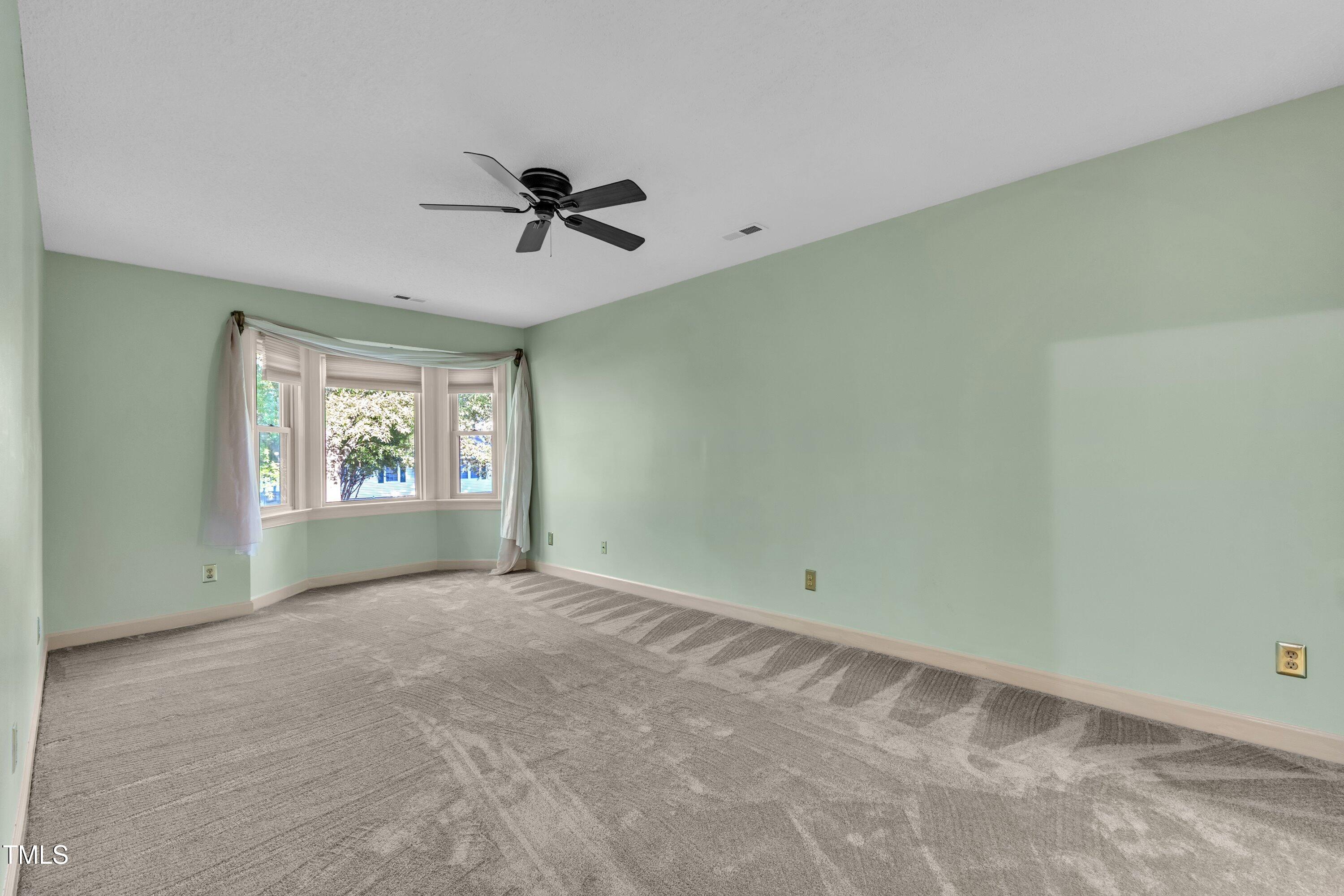 1210 Shadow Bark Court Raleigh, NC 27603 - Photo 23 of 32 a view of an empty room with a window