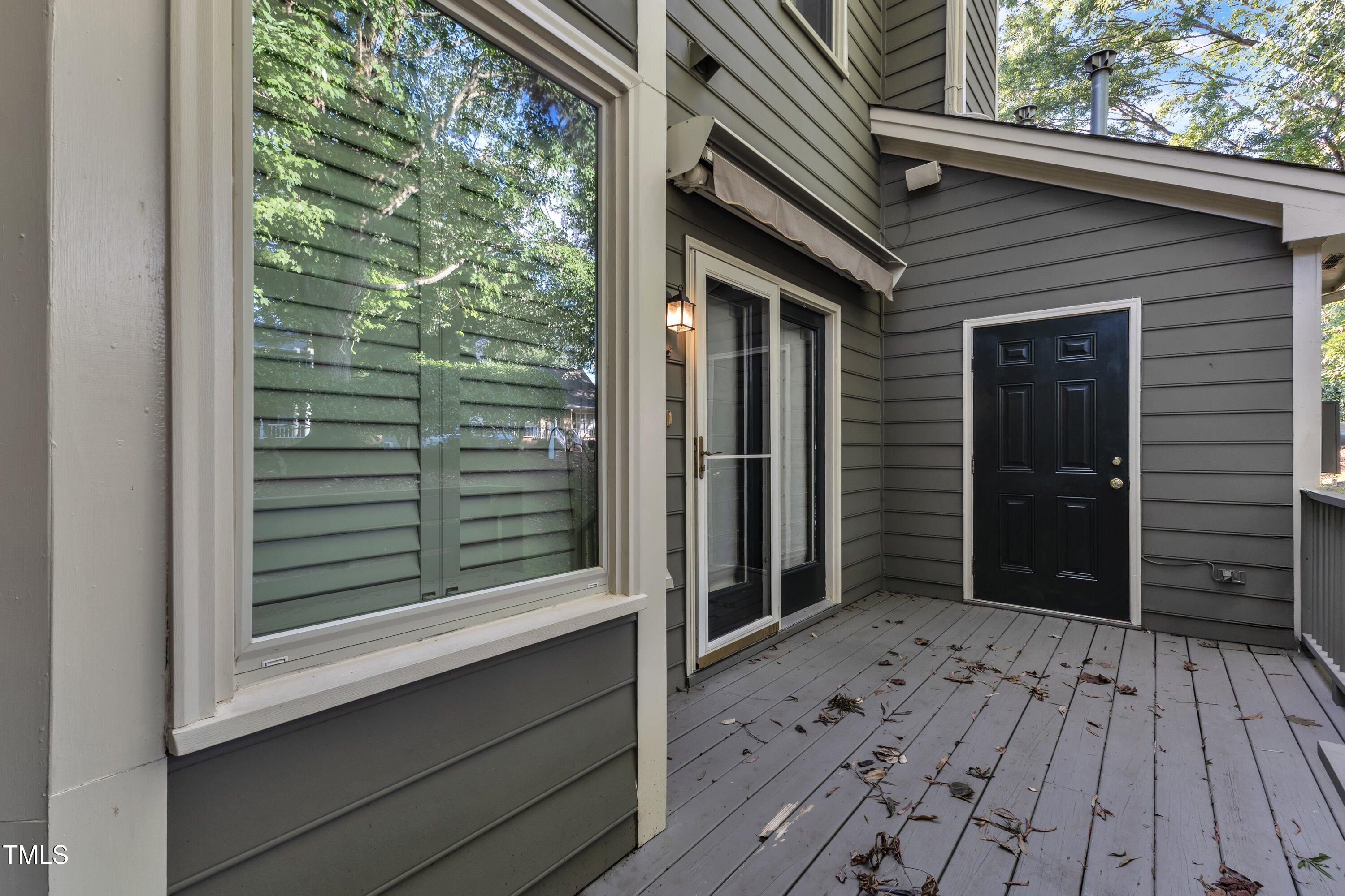 1210 Shadow Bark Court Raleigh, NC 27603 - Photo 30 of 32 a view of a wooden door and a window