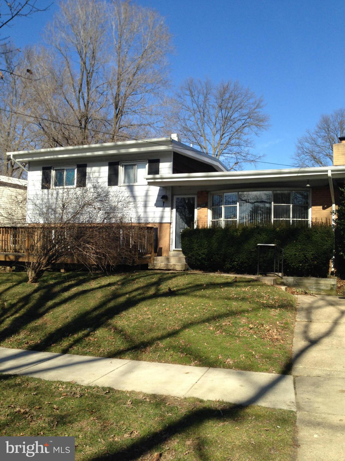 13119 Estelle Road Silver Spring, MD 20906 - Photo 1 of 7 a front view of a house with a yard