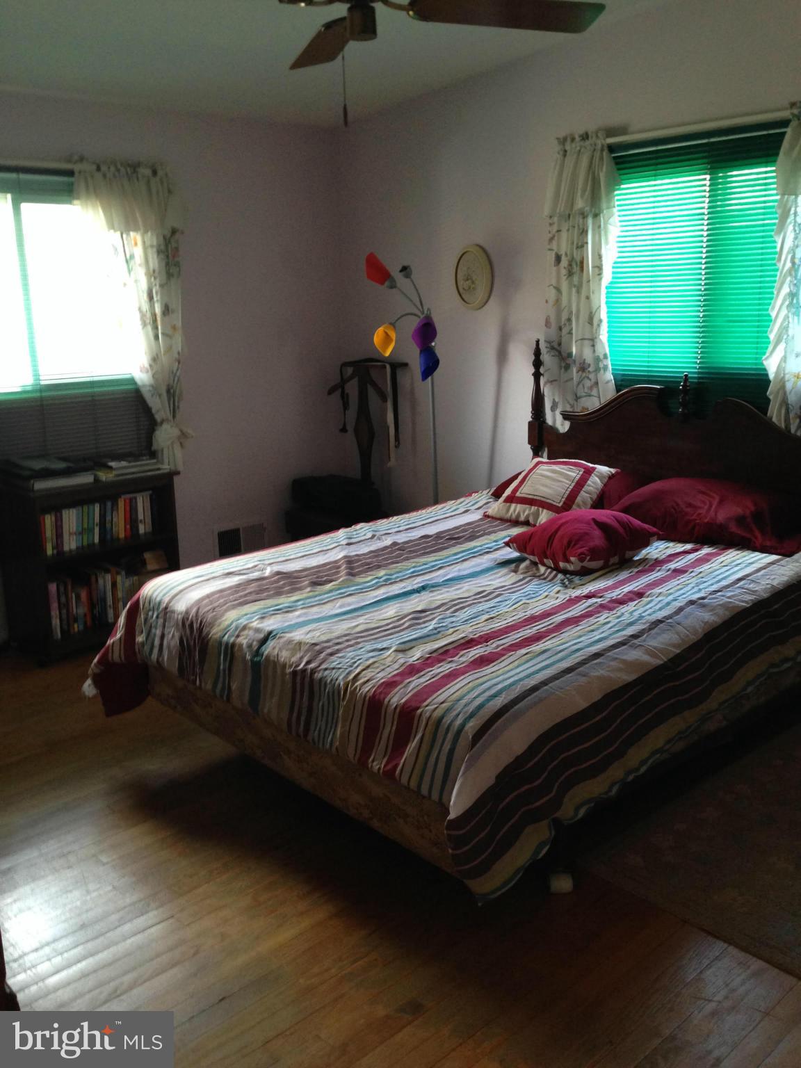 13119 Estelle Road Silver Spring, MD 20906 - Photo 3 of 7 a bedroom with a bed and a window