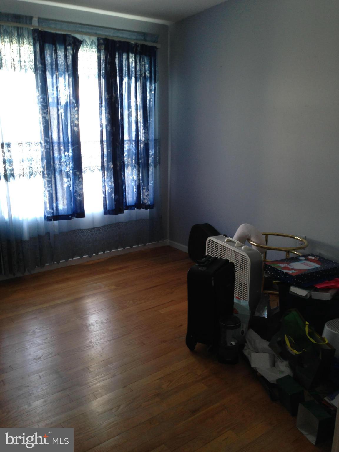 13119 Estelle Road Silver Spring, MD 20906 - Photo 6 of 7 an empty room with wooden floor
