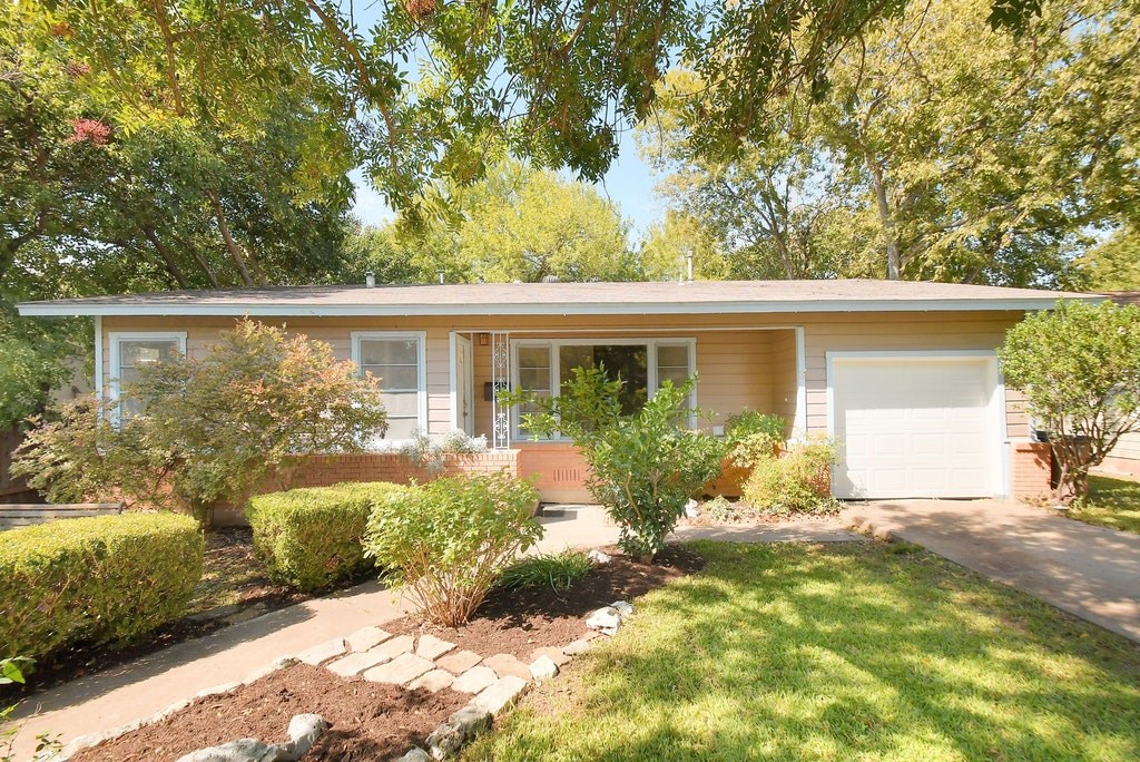7710 Rutgers Avenue Austin, TX 78757 - Photo 1 of 1 front view of house with a yard
