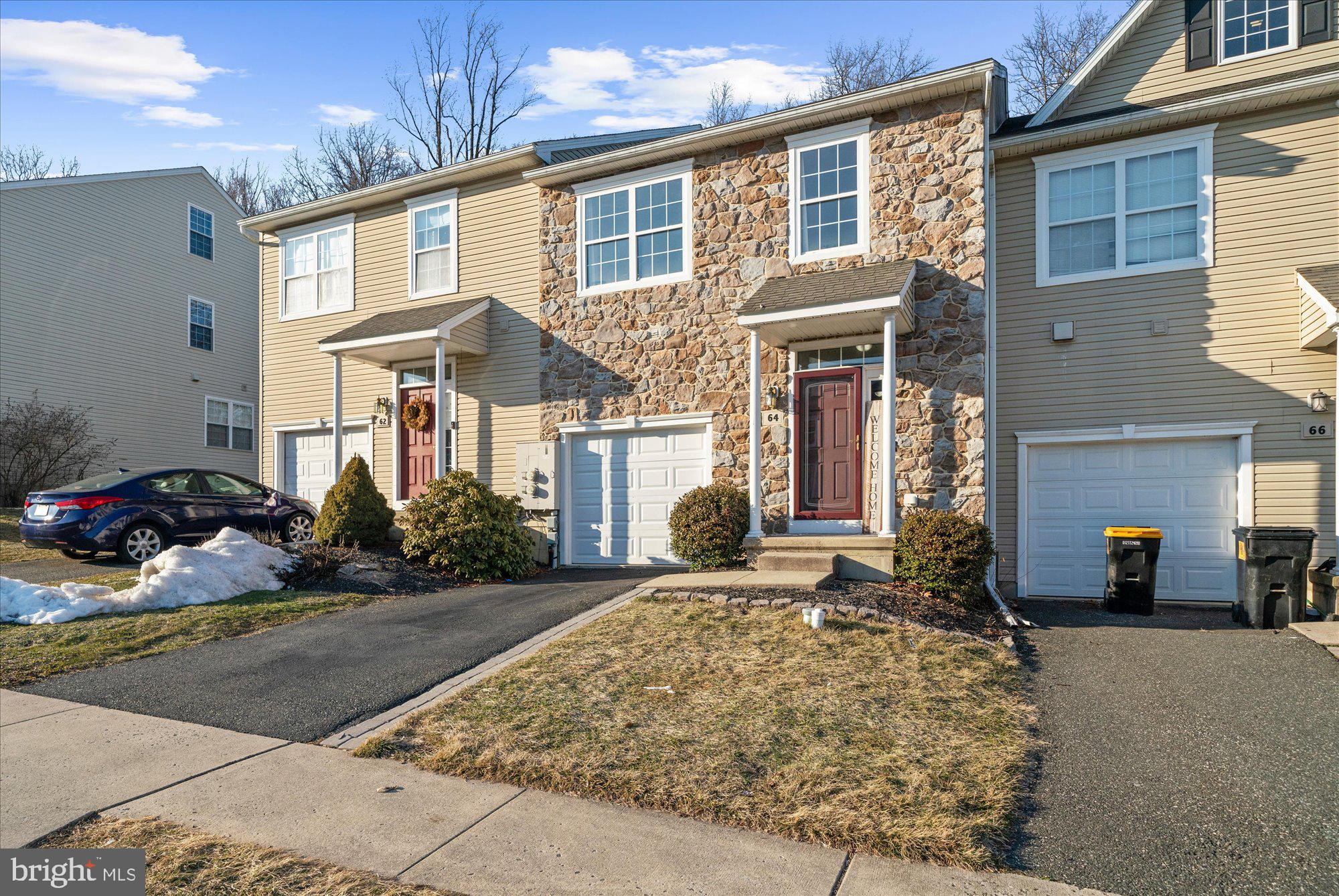 64 Sugar Maple Road Barto, PA 19504 - Photo 2 of 28 a front view of a house with garden