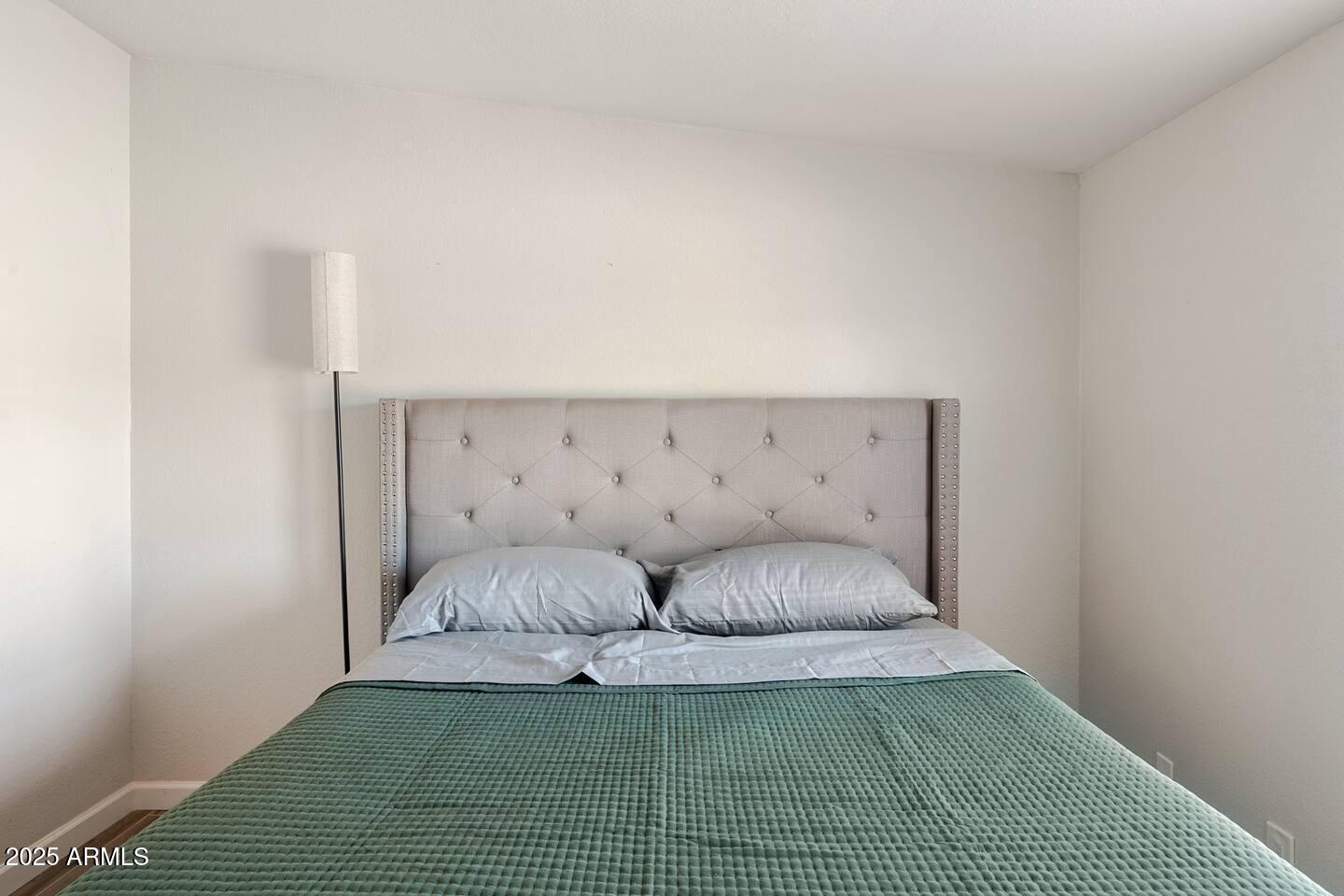 1514 East Fillmore Street Phoenix, AZ 85006 - Photo 12 of 24 a living room with furniture and a rug
