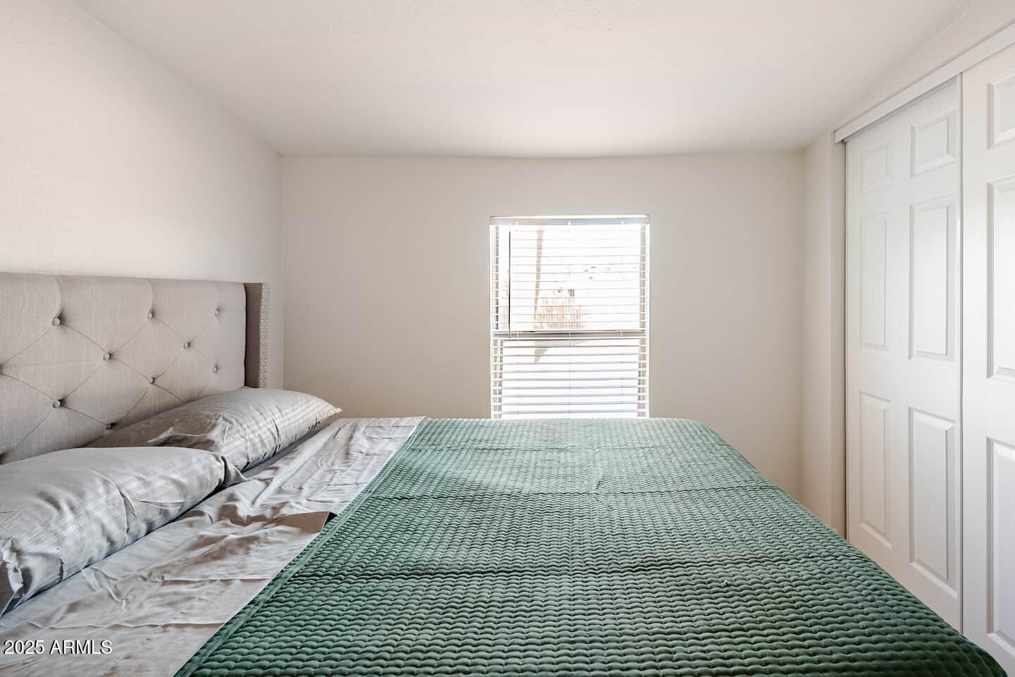 1514 East Fillmore Street Phoenix, AZ 85006 - Photo 16 of 24 a bedroom with a bed and a window