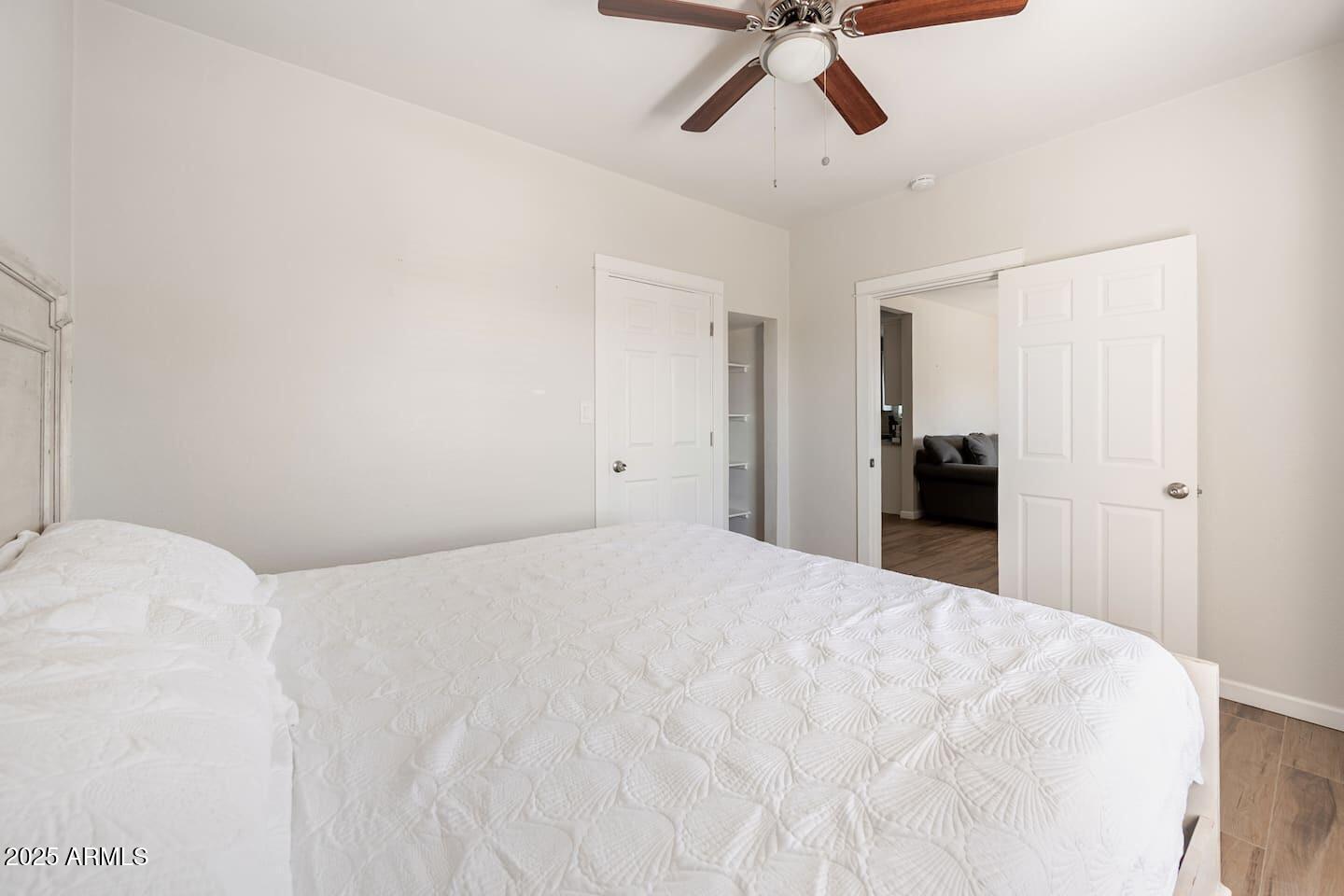 1514 East Fillmore Street Phoenix, AZ 85006 - Photo 19 of 24 a view of a bedroom with a bed and cabinets