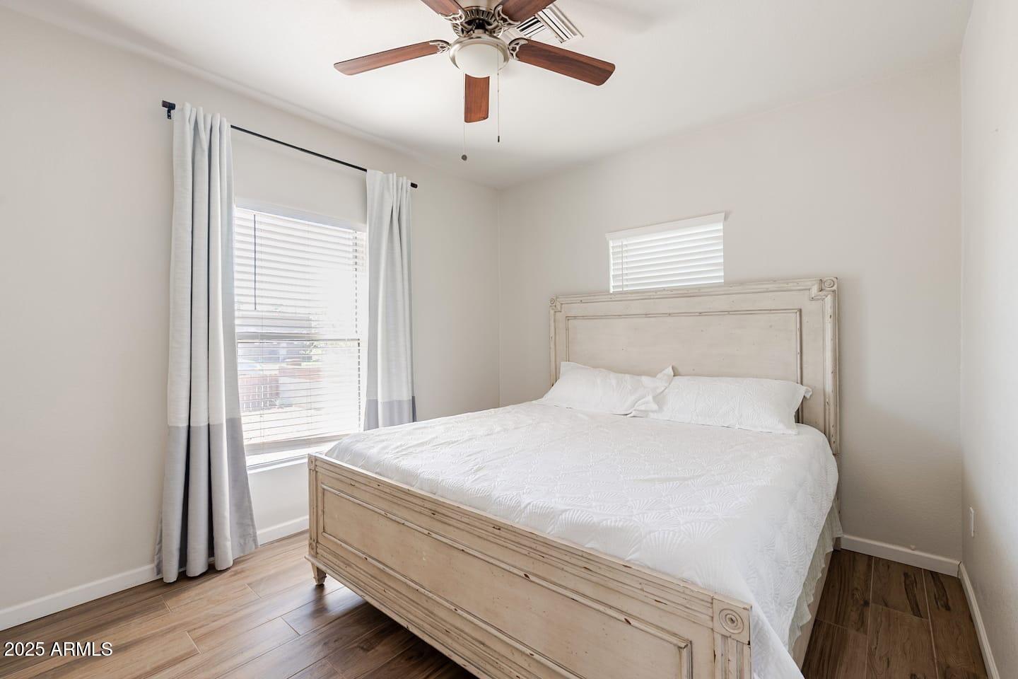 1514 East Fillmore Street Phoenix, AZ 85006 - Photo 20 of 24 a bedroom with a bed and a window