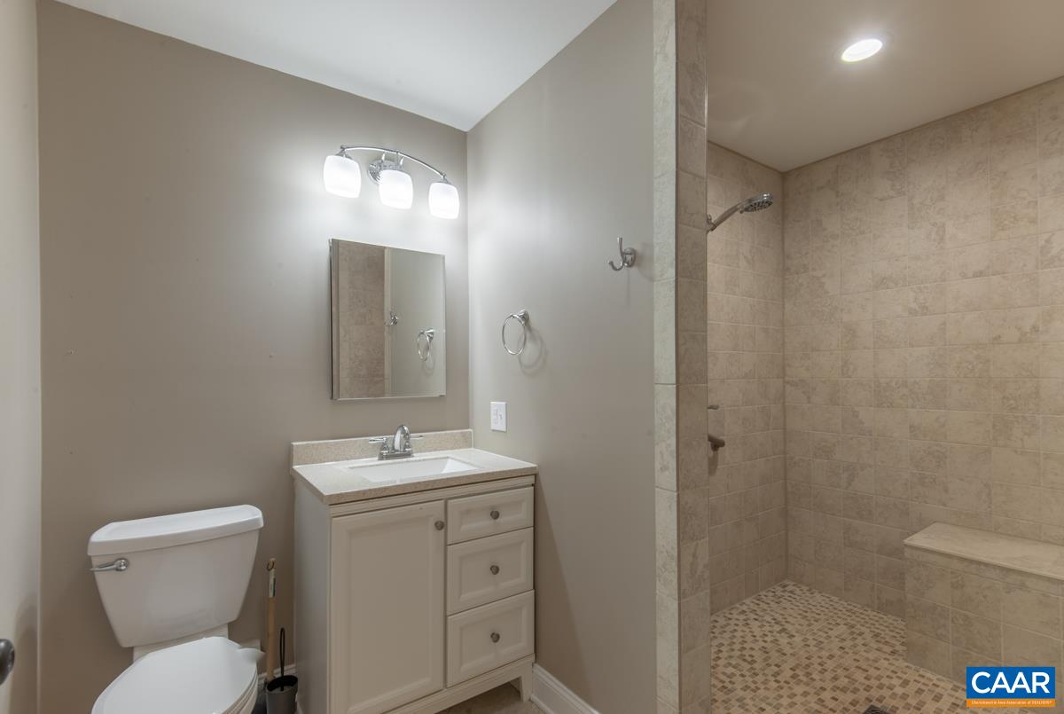 8882 James River Road Shipman, VA 22971 - Photo 11 of 50 a bathroom with a toilet sink and shower