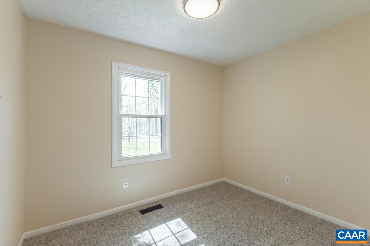8882 James River Road Shipman, VA 22971 - Photo 14 of 50 an empty room with a window