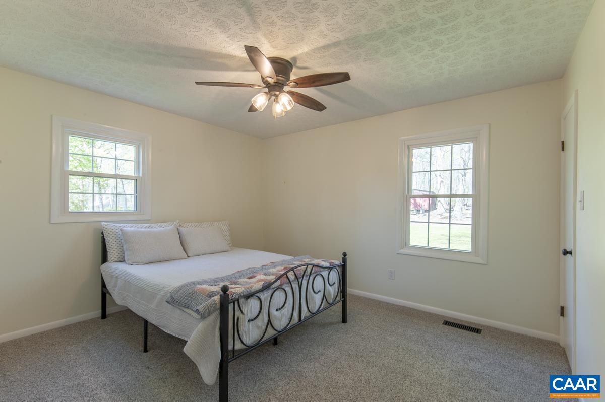 8882 James River Road Shipman, VA 22971 - Photo 16 of 50 a bedroom with a bed and window