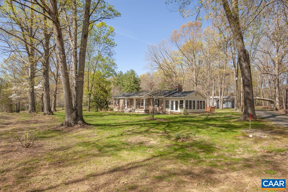 8882 James River Road Shipman, VA 22971 - Photo 2 of 50 a front view of a house with a garden