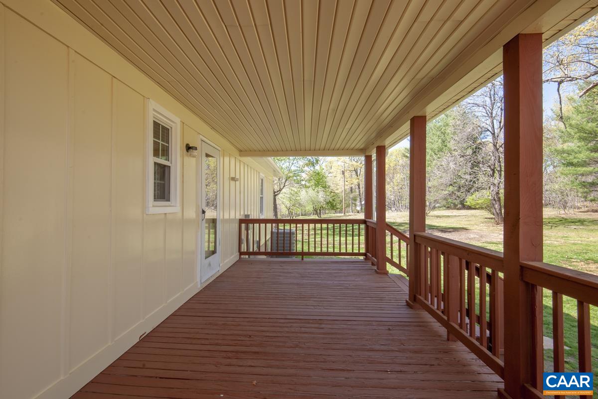 8882 James River Road Shipman, VA 22971 - Photo 26 of 50 a view of a room with wooden floor and iron stairs