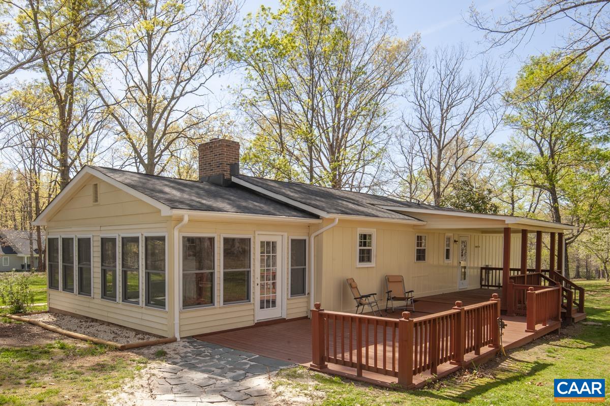 8882 James River Road Shipman, VA 22971 - Photo 28 of 50 a view of a house with wooden deck and a large tree
