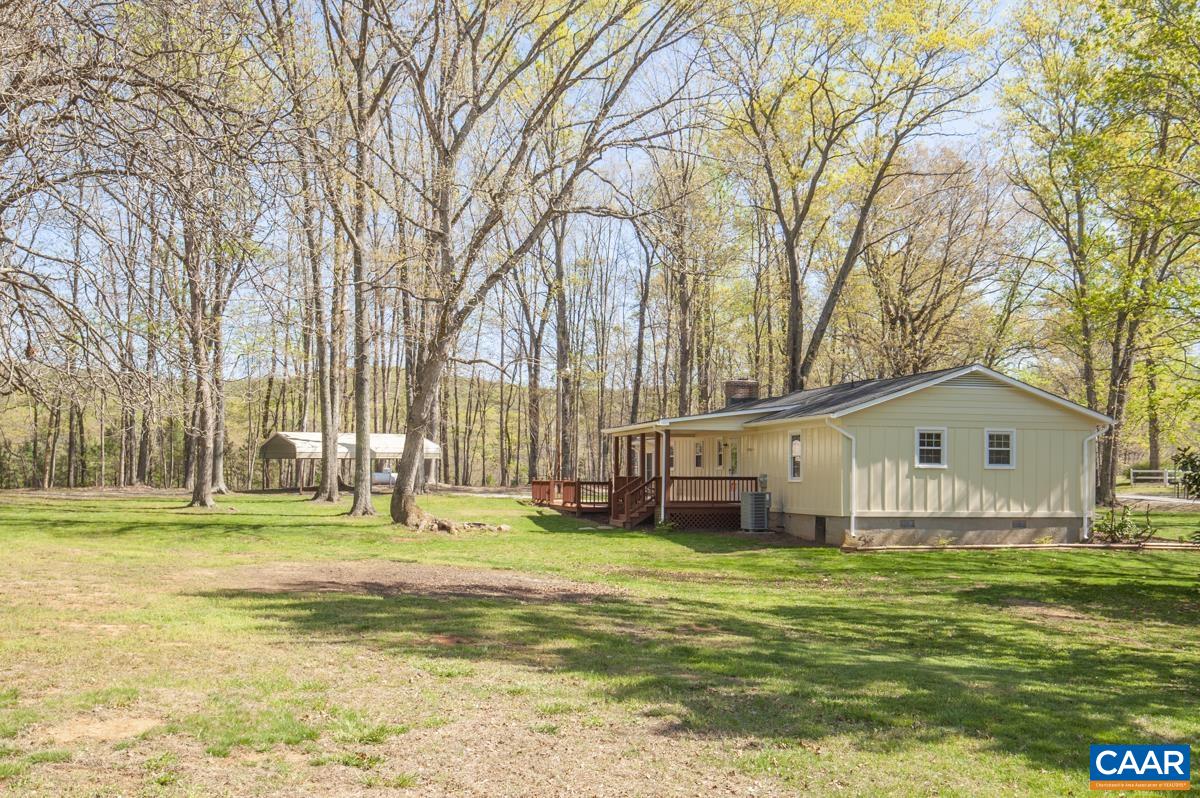 8882 James River Road Shipman, VA 22971 - Photo 32 of 50 a view of a house with a big yard and large trees