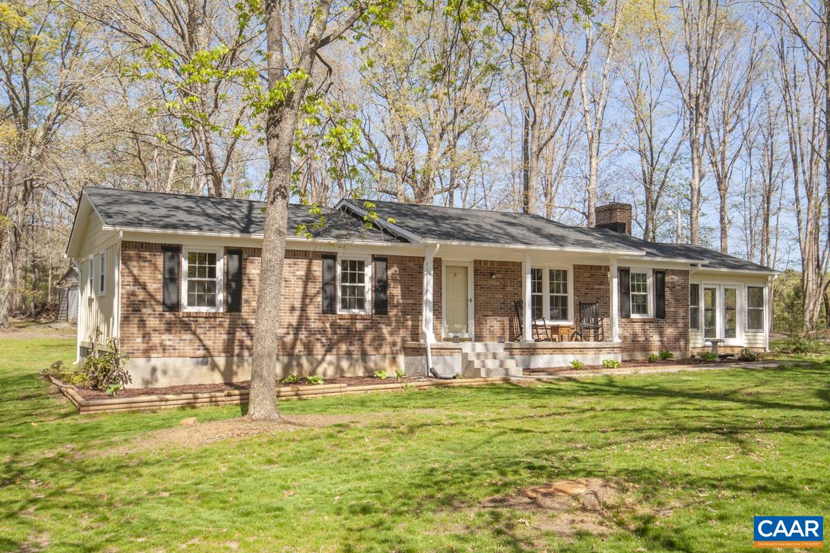 8882 James River Road Shipman, VA 22971 - Photo 40 of 50 a front view of a house with a yard table and chairs