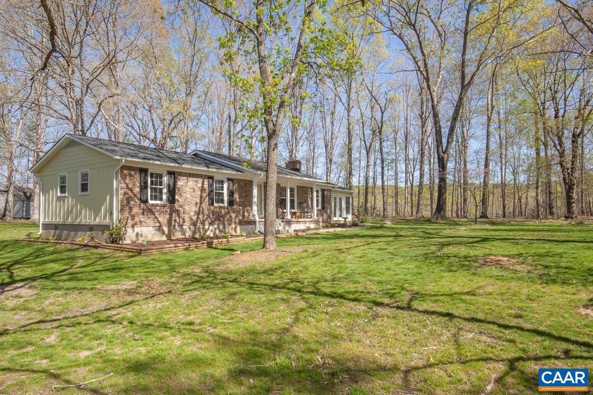 8882 James River Road Shipman, VA 22971 - Photo 41 of 50 a front view of a house with garden and porch
