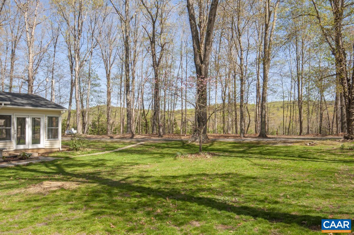 8882 James River Road Shipman, VA 22971 - Photo 42 of 50 a swimming pool with outdoor seating and yard