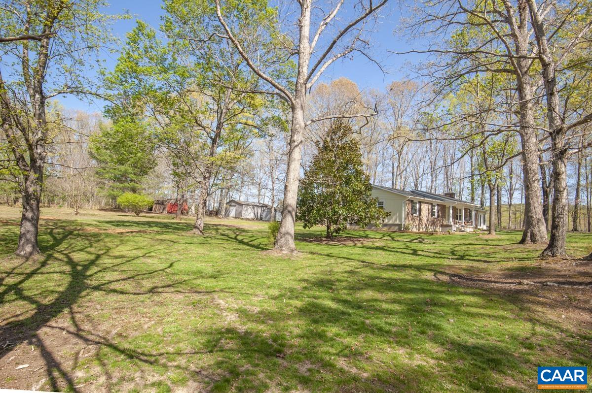 8882 James River Road Shipman, VA 22971 - Photo 44 of 50 a backyard of apartments with large trees