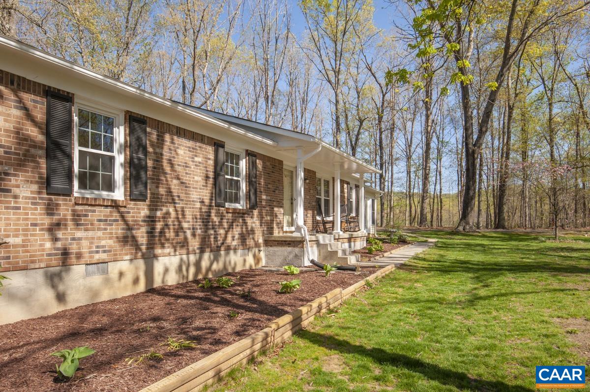 8882 James River Road Shipman, VA 22971 - Photo 48 of 50 a backyard of a house with outdoor seating