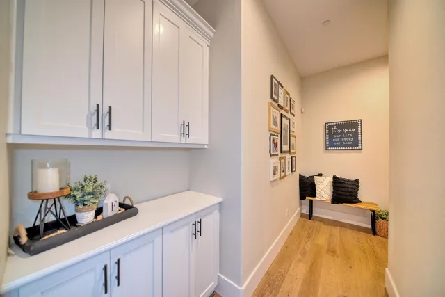 a bathroom with a sink and cabinets
