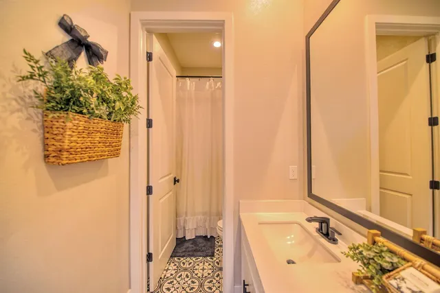 a bathroom with a tub a sink and a shower