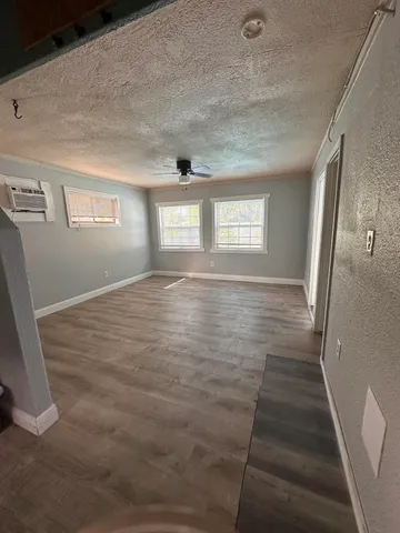 a view of an empty room and window