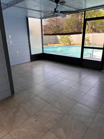 a view of empty room with large window