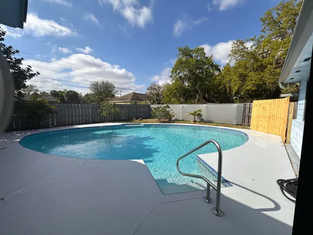a view of a swimming pool with a garden