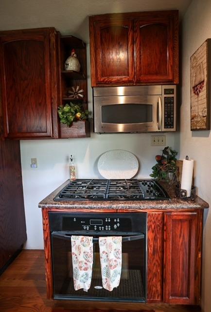 57064 Road 225 North Fork, CA 93643 - Photo 2 of 9 a stove top oven sitting inside of a kitchen