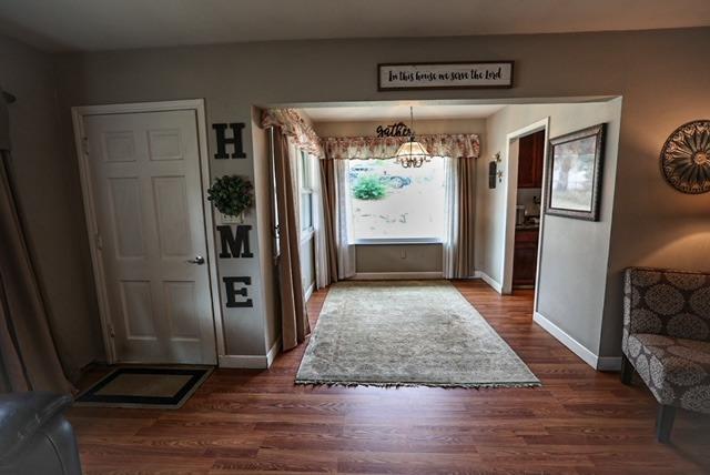 57064 Road 225 North Fork, CA 93643 - Photo 4 of 9 a view of a hallway with wooden floor and windows