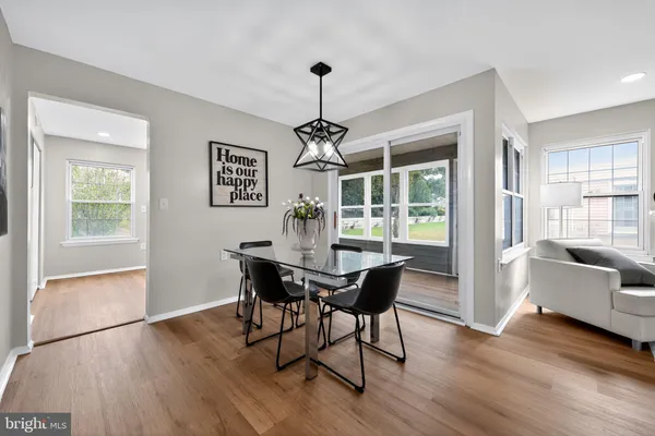 a dining room with furniture window wooden floor