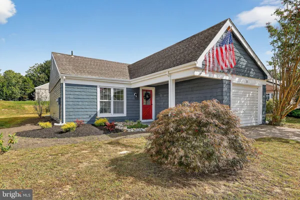 a front view of house with yard outdoor seating and barbeque oven