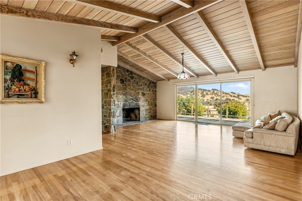 3546 Huffmaster Road Stonyford, CA 95979 - Photo 11 of 56 a living room with furniture and a fireplace