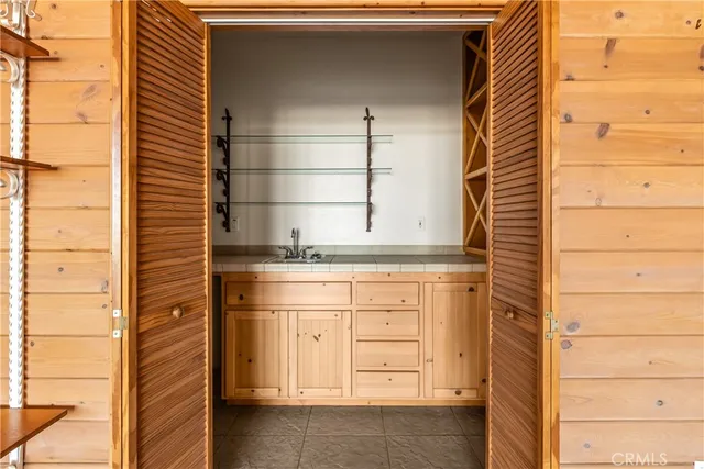 a view of an empty room with large windows