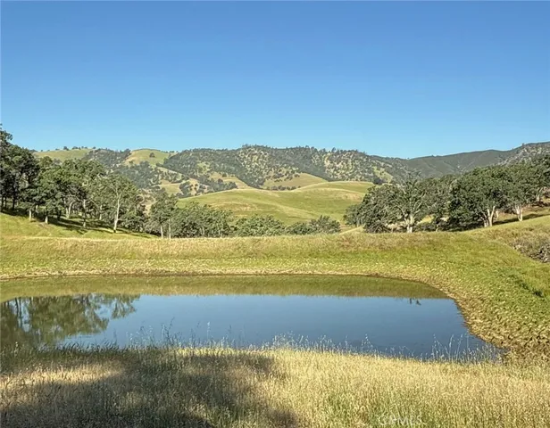 a view of an ocean and a mountain