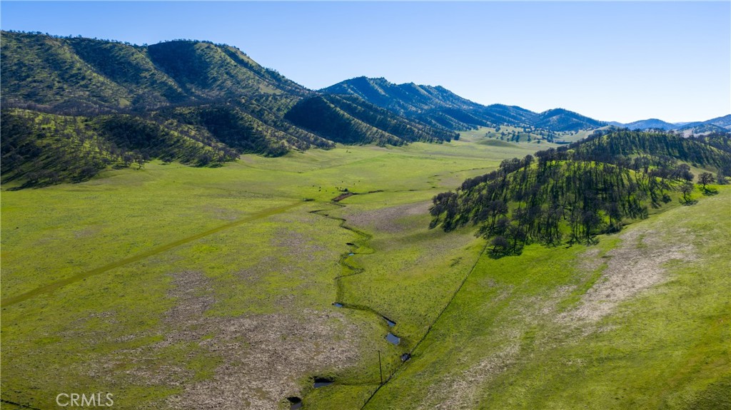 3546 Huffmaster Road Stonyford, CA 95979 - Photo 38 of 56 a view of a lake with a mountain in the background