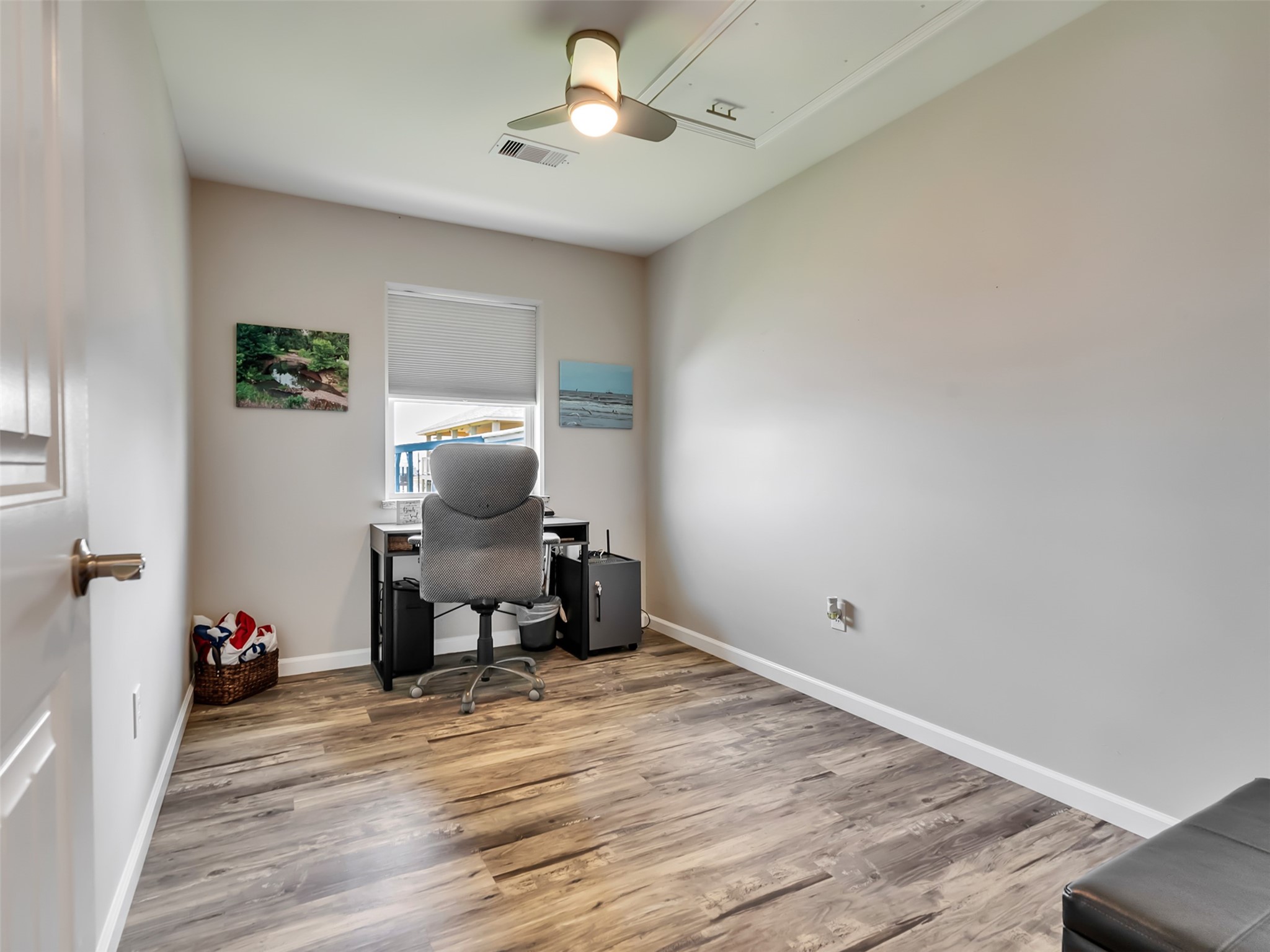 1453 County Road 230 Sargent, TX 77414 - Photo 17 of 38 Office/Bedroom/Flex Room — This versatile space, perfect as a cozy bedroom or productive home office, features an abundance of natural light and relaxing water views from the window.