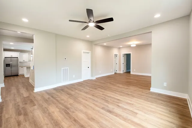 a bathroom with a double vanity sink a large mirror and shower