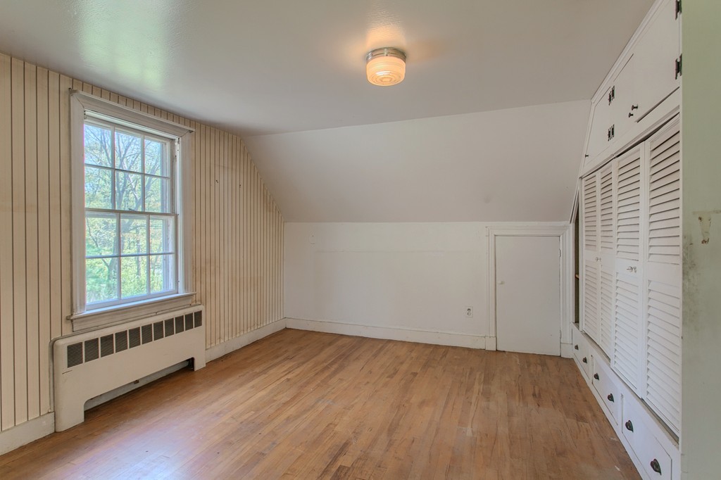 335 Ayer Road Harvard, MA 01451 - Photo 14 of 22 an empty room with wooden floor and windows