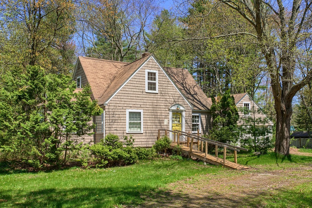335 Ayer Road Harvard, MA 01451 - Photo 2 of 22 a view of a house with a yard and sitting area