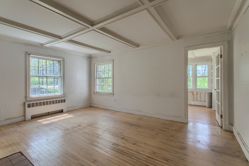 335 Ayer Road Harvard, MA 01451 - Photo 7 of 22 an empty room with wooden floor and windows