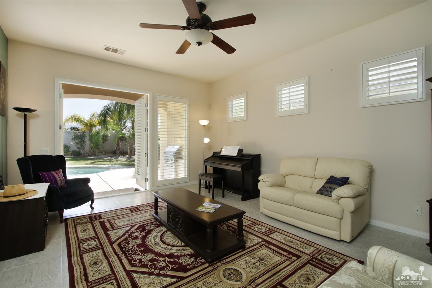 47 Provence Way Rancho Mirage, CA 92270 - Photo 3 of 30 a living room with furniture and a large window