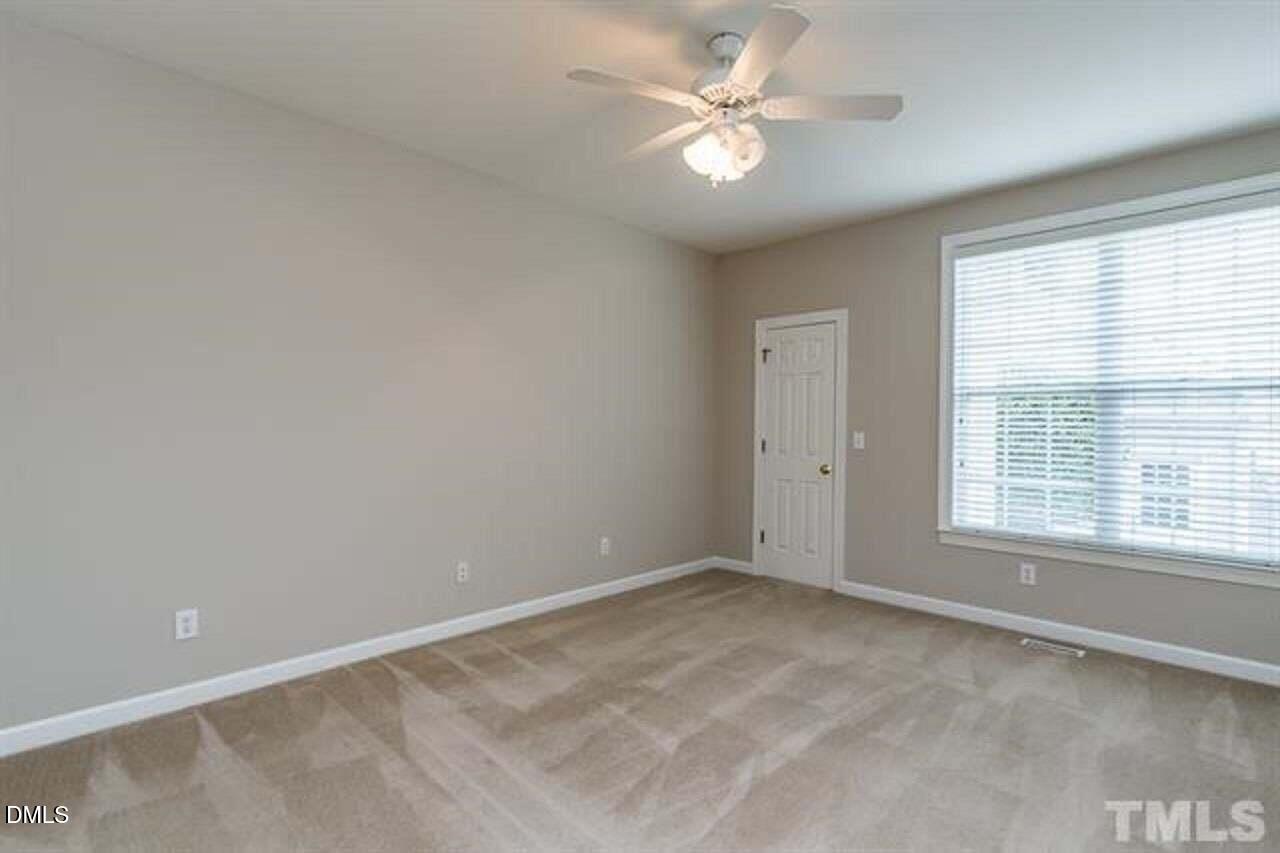 1216 Colonial Club Road Wake Forest, NC 27587 - Photo 15 of 26 an empty room with a window