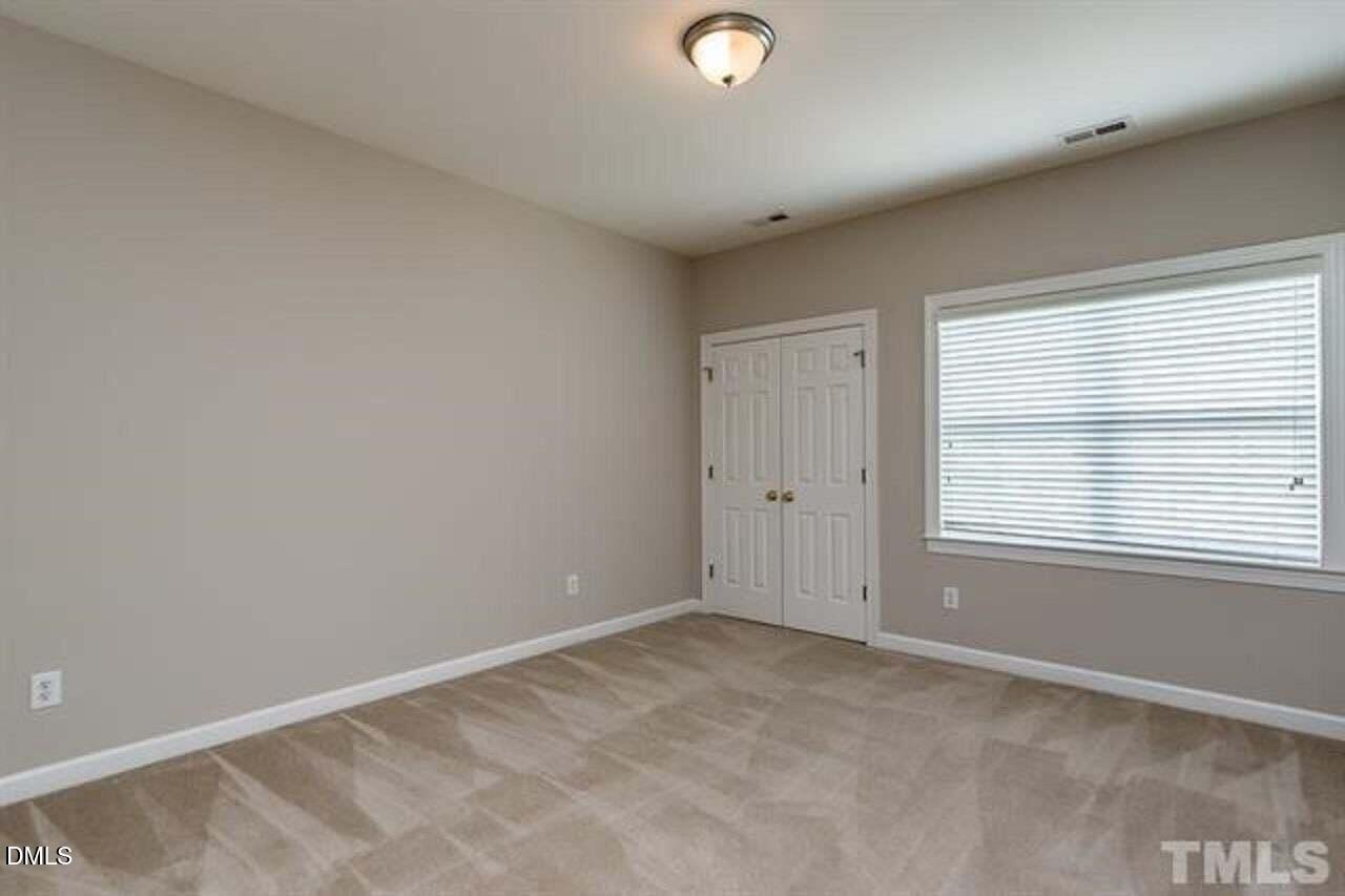 1216 Colonial Club Road Wake Forest, NC 27587 - Photo 19 of 26 a view of an empty room with a window