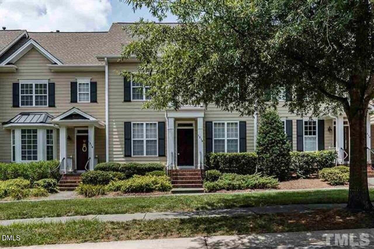 1216 Colonial Club Road Wake Forest, NC 27587 - Photo 2 of 26 front view of a house with a yard