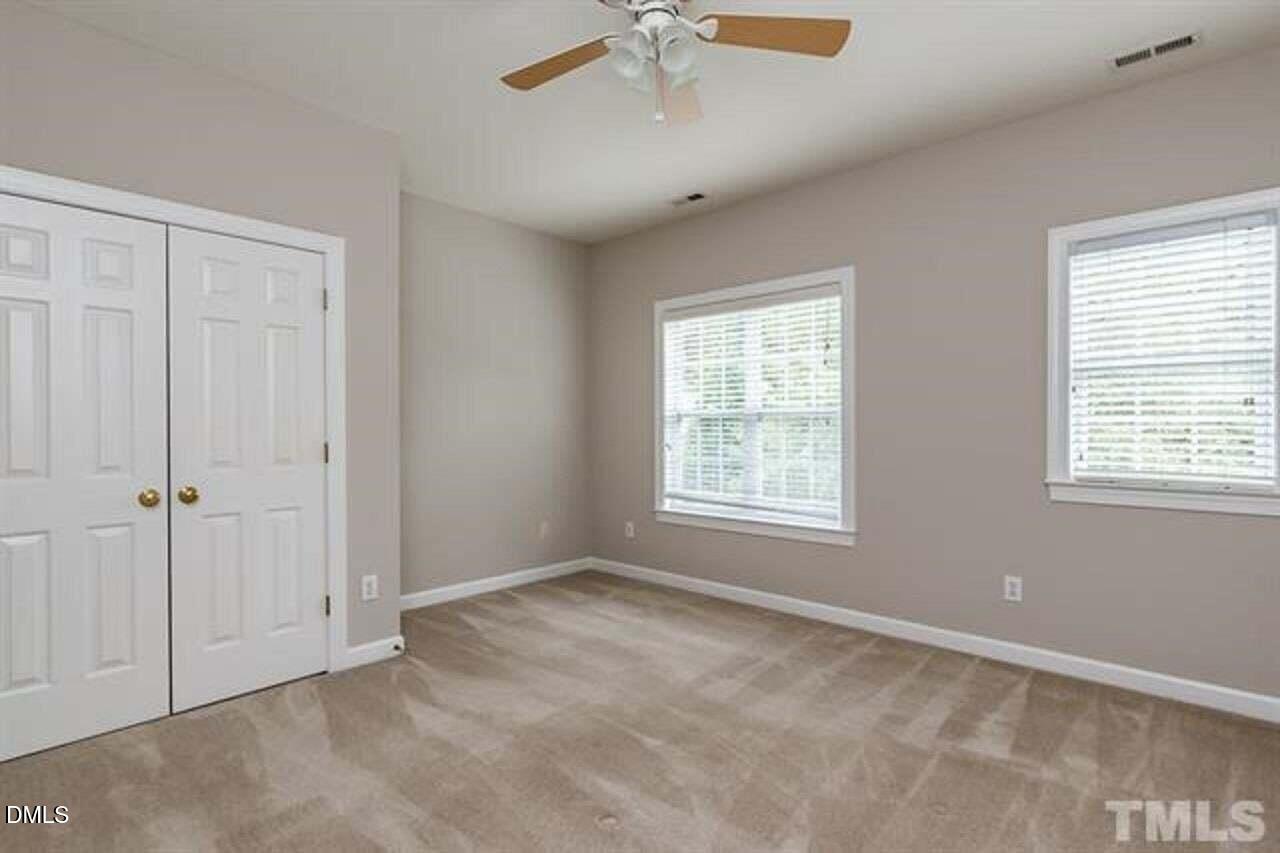1216 Colonial Club Road Wake Forest, NC 27587 - Photo 21 of 26 a view of an empty room with a window
