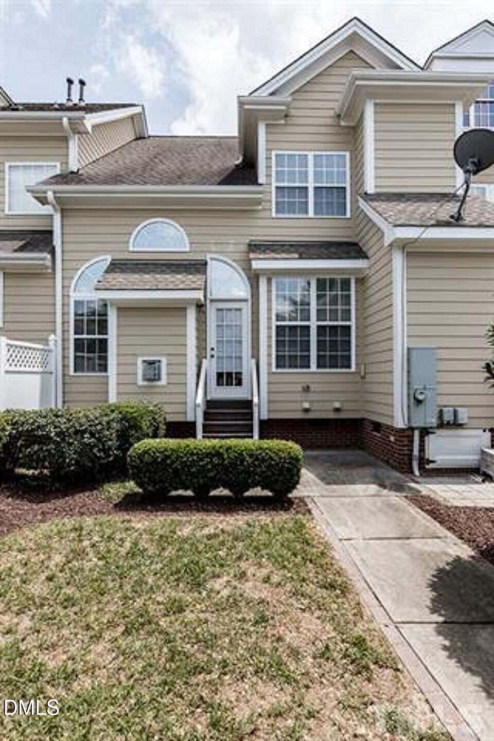 1216 Colonial Club Road Wake Forest, NC 27587 - Photo 25 of 26 a front view of a house with a yard